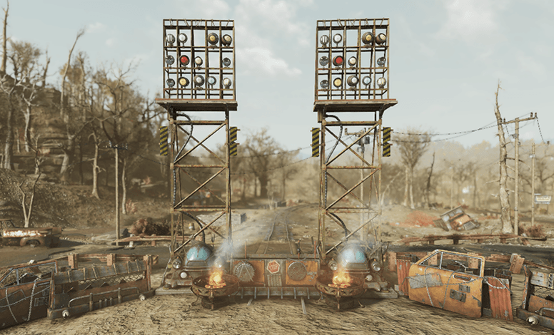 Two tall metal towers with signal lights flank a spiked raider gate, with burning barrels and scrap walls blocking a dusty Appalachian road.
